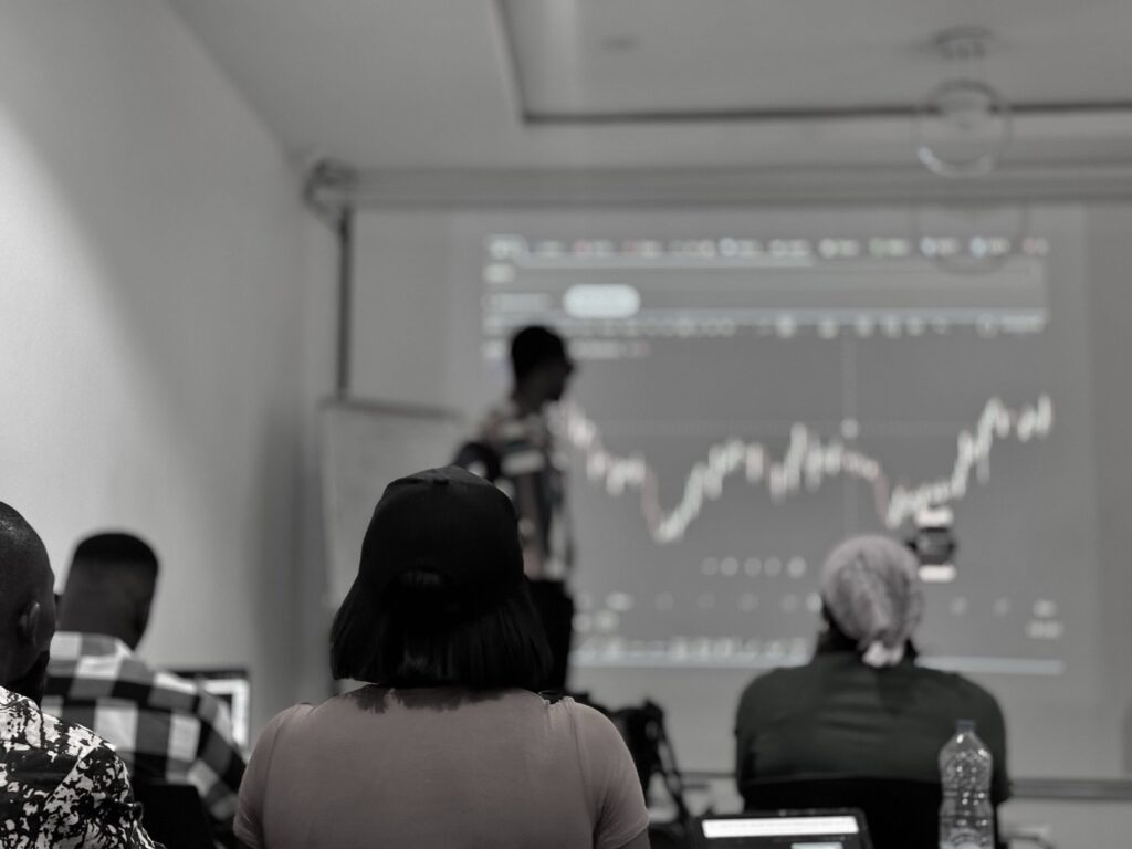 ESTT learners studying live Forex market charts