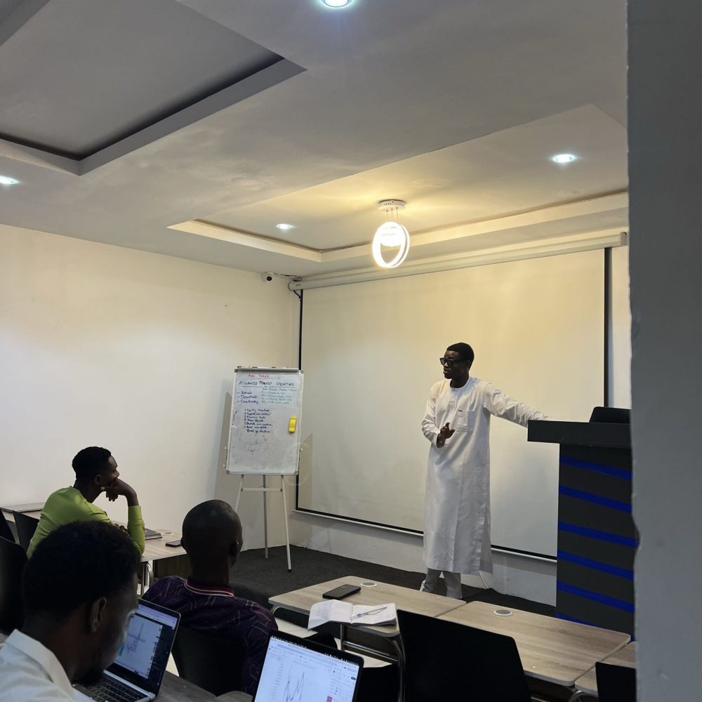 An ESTT tutor leading a cryptocurrency trading session